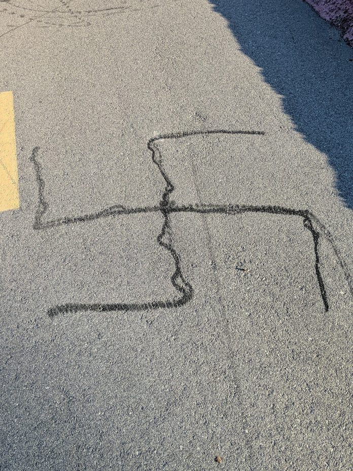 A swastika found on the ground near Lot 71.