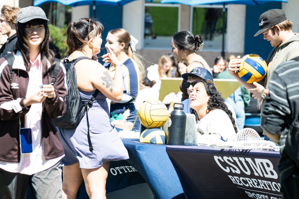 image of students talking to club stands at otter showcase