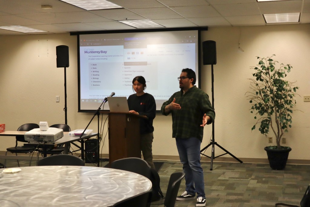 Photo of 2 event staff presenting