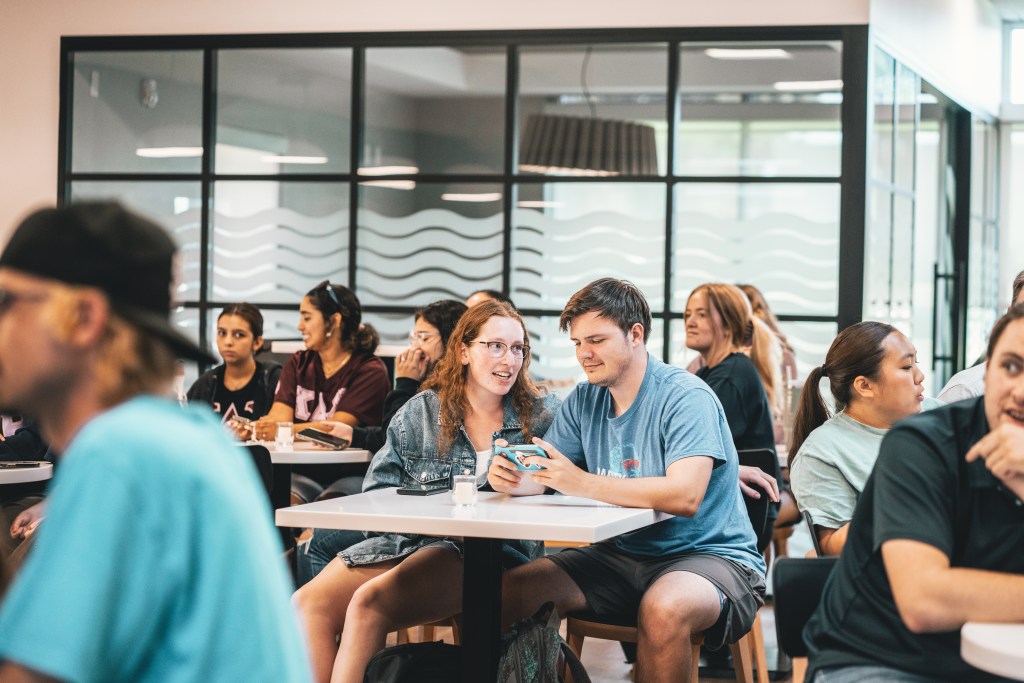 Allison Berry, pictured-left and Noah Sherwood, pictured-right using a phone for the Kahoot App.