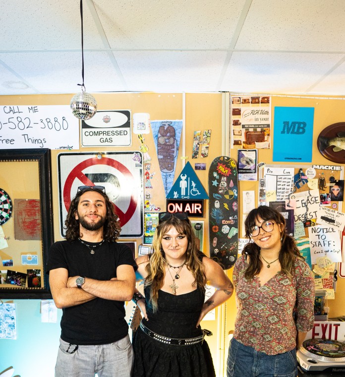 A picture of 3 otter media staff lined up side by side