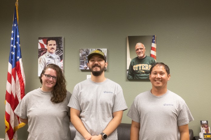 picture of three members from the Veterans Resource Center smiling at the camera