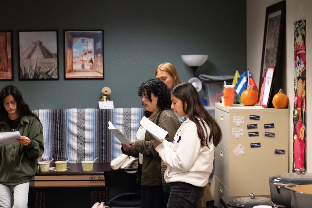 Picture of students standing and reciting poetry.