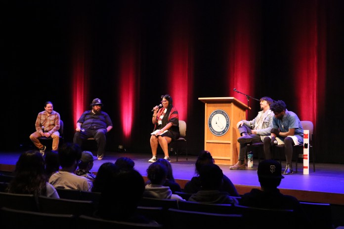 Picture of 5 writers on stage talking to an audience