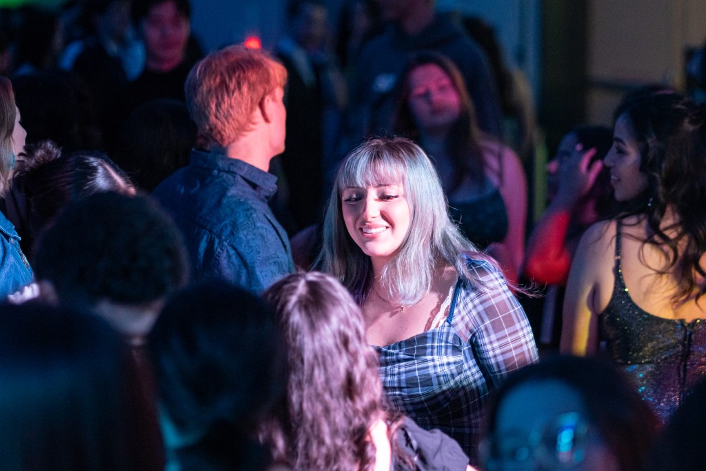 close up picture of someone in the crowd smiling