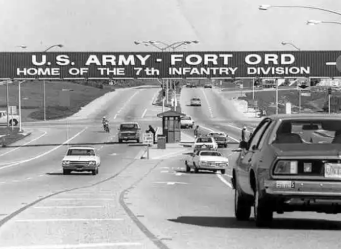 A picture of Highway One from the past that shows the entry sign for Fort Ord