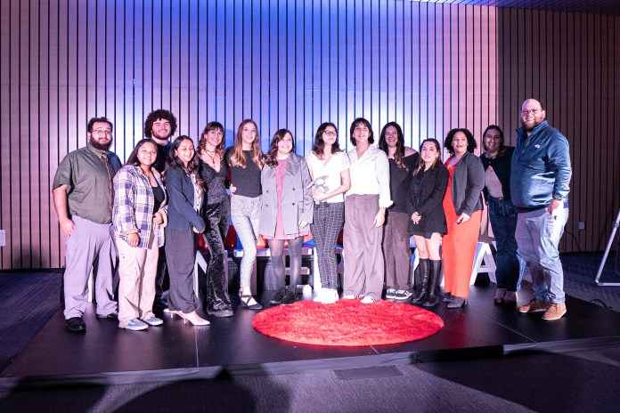Picture of all of the speakers from the TedX grouped together posing for a picture