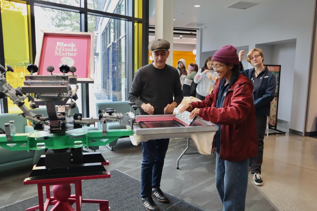 Picture of People using the Ink Press Machine