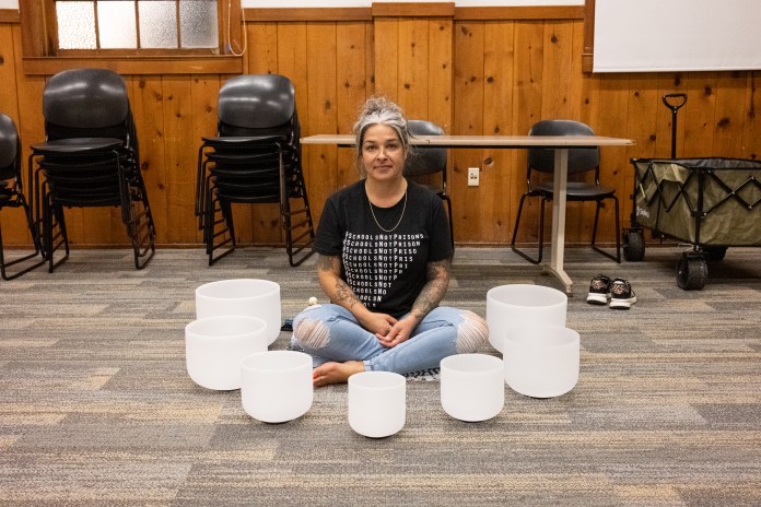 Picture of a woman and her sound bath tools