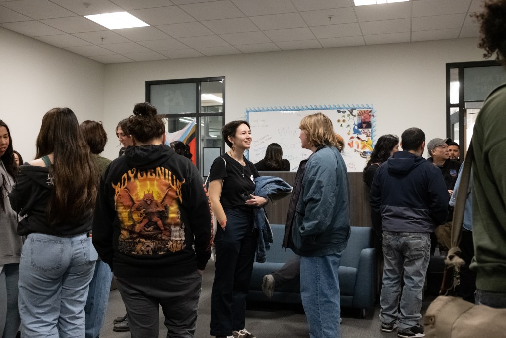 Picture of students in a crowd socializing