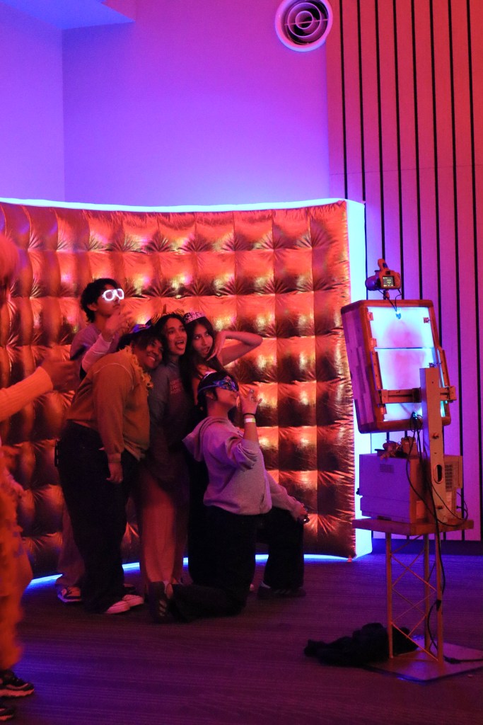 Picture of students in a photobooth posing for a picture