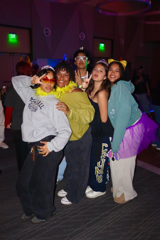 a group of students fitted up and posing