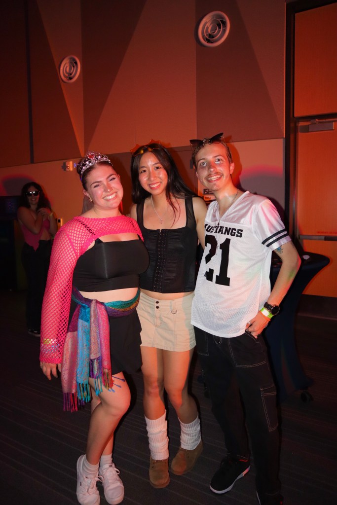 3 students posed and fitted up